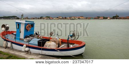 Small Fishing Boat Moored On The Bank Of The River Magra. Bocca Di Magra, Tuscany And Liguria, Italy