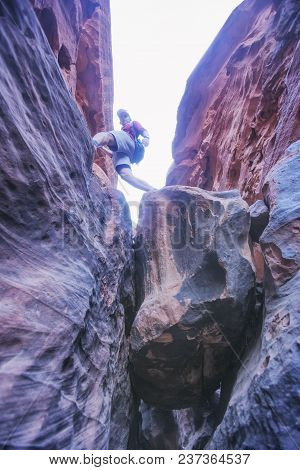 Tourist On The Rocks, Canyon Of Khazali. Wadi Rum Desert, Jordan