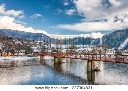 Slovak Village Of Nezbudska Lucka Near Strecno In The Winter, River The Vah With The Bridge In The F