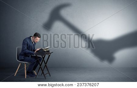 Shadow threatening hard worker man who is afraid