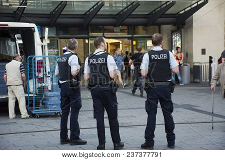 German Police Men Standing Security For People And Travelers At Front Of Mannheim Hauptbahnhof Railw