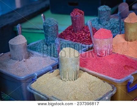 Various Spices From The Street Market. Colorful Georgian Suneli On Glasses In A Row. Oriental Spices