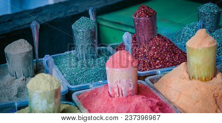 Various Spices From The Street Market. Colorful Georgian Suneli On Glasses In A Row. Oriental Spices
