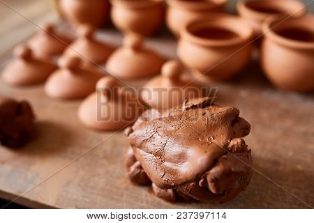Making Pottery On A Potter's Wheel In The Workshop, Close-up, Selective Focus.