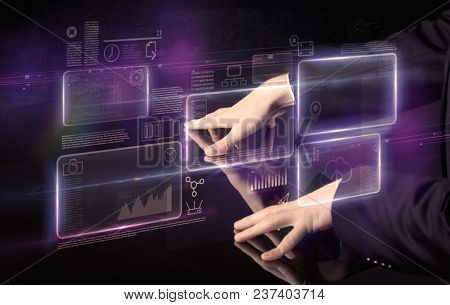 Male hands touching interactive table with purple cloudspace graphic on it 