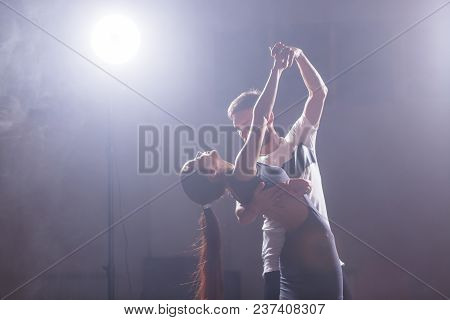 Young Couple Dancing Social Danse Kizomba Or Bachata Or Semba Or Taraxia In Dancing Class Background