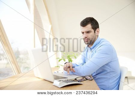 Young Businessman Working On Laptop