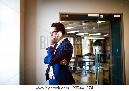 Successful Business Man Having Serious Talks With An International Partner Via Portable Mobile Phone