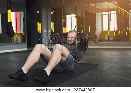 Young Cheerful Man Workout In Fitness Club. Portrait Of Caucasian Guy Making Exercise, Sit-ups And C