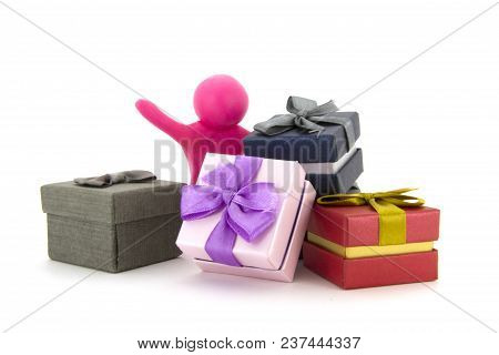 Pink Plasticine Character And Gift Boxes On White Background. Present Boxes. Holidays Concept.