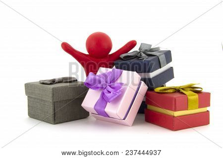 Red Plasticine Character And Gift Boxes On White Background. Present Boxes. Holidays Concept.