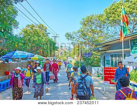 Kyaiktiyo, Myanmar - February 16, 2018: The Crowded Street Along The Mountain Slope Leads To The Ent