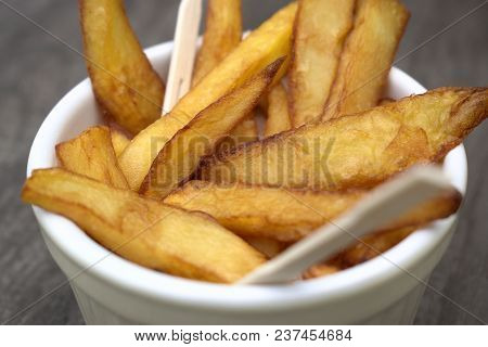 Tasty Food, Nutrition, Kitchen And Culinary Concept: Homemade Fries In Bowl For Snacks On Wooden Bac