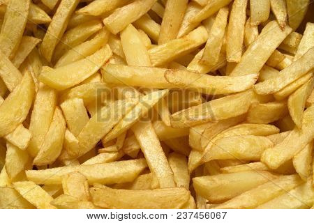 Tasty Food, Nutrition, Kitchen And Culinary Concept: Close-up Homemade French Fried Potatoes Backgro