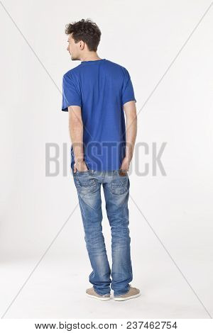 Man Pointing Hands In His Pockets And Looking To The Left