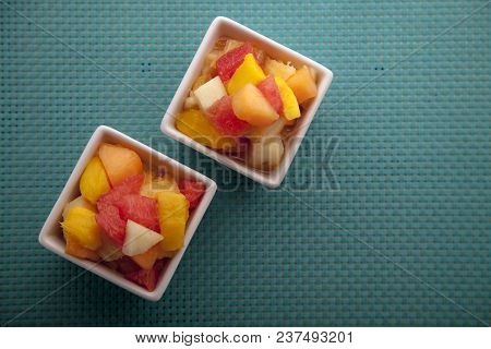 Fruit Salad Mix Of Melon, Banana, Watermelon, Orange And Pineapple In A Small Porcelain Bowl, Breakf