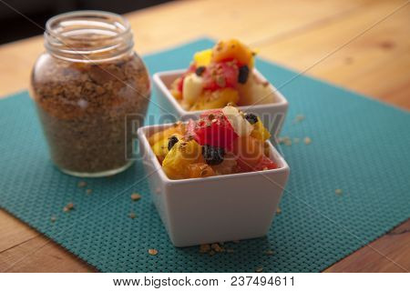 Fruit Salad Mix Of Melon, Banana, Watermelon, Orange And Pineapple In A Small Porcelain Bowl, Breakf