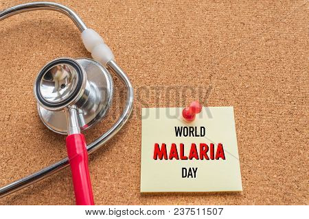 World Malaria Day April 25, Healthcare And Medical Concept. Stethoscope, Handmade Red Heart, Thermom