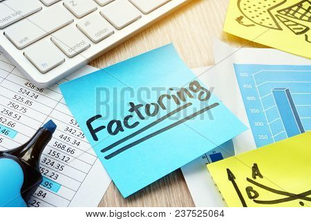 Stick With Word Factoring On A Desk. Factor Concept.