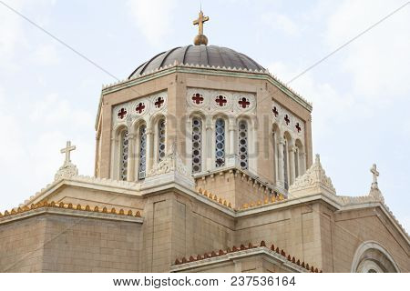 Mitropoli, historic Greek Orthodox Cathedral in Athens. Cloudy sky over Panagia Annunciation church.