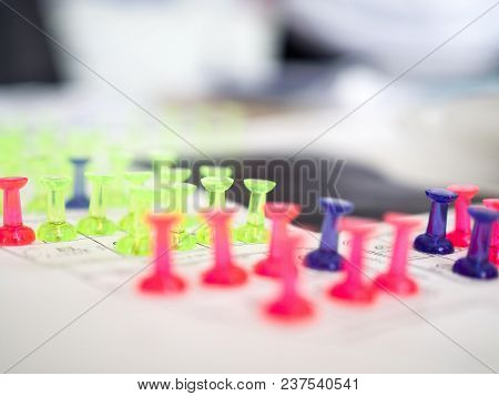 Close Up Of Colorful Push Pins Marking For Real Estate Resevation