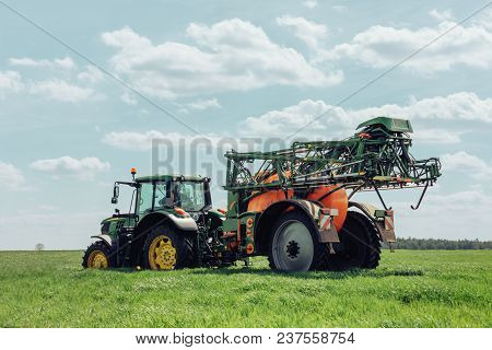 Varna Region, Bulgaria - April 19, 2019: A Modern John Deere 6120m Tractor On A Green Field.the 6120