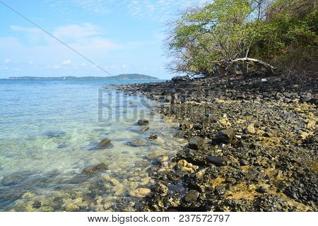 Koh Hin Ngam  Is A Unique Small Island Unlike Other Island. It's Covered With Small Black Rocks