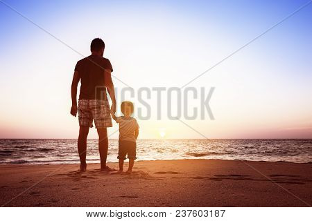 Father And Son Beach Sunset Holidays Concept