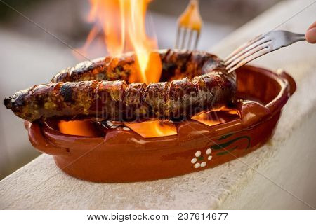 Traditional Portuguese Chourico Or Spanish Chorizo Prepared In A Special Clay Pot