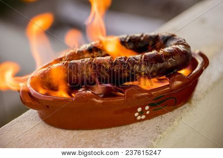 Traditional Portuguese Chourico Or Spanish Chorizo Prepared In A Special Clay Pot