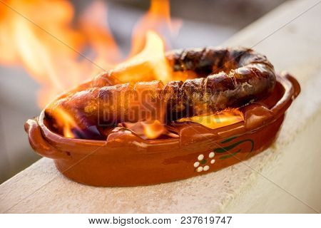 Traditional Portuguese Chourico Or Spanish Chorizo Prepared In A Special Clay Pot