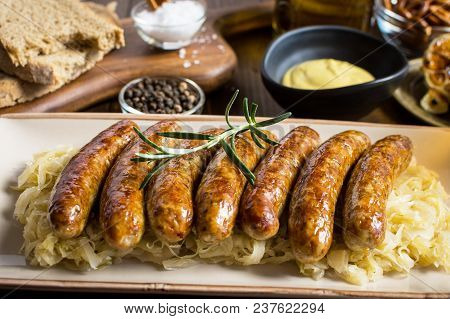 Grilled Sausages With Cabbage Salad, Mustard And Beer. Bratwurst And Sauerkraut.