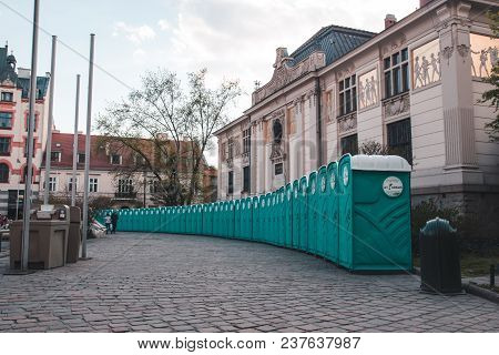 Krakow, Poland, April 21, 2018, Many Green Biotoilets Stand Side By Side On The Square Of The Old Ci