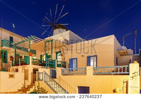 White Windmill On A Hill Above The City Chora On Sunset. Mykonos. Greece. Chora.