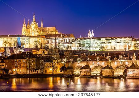 View Of Charles Bridge, Prague Castle And Vltava River In Prague, Czech Republic During Sunset Time.