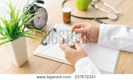 Female Doctor Holding Unlabeled Generic Tablets And Medication, Generic Drugs Concept, Prescription 