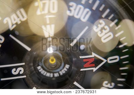 Close Up Of A Naval Compass With Bokeh