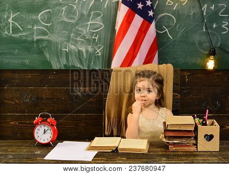Student With Books In Park Against Usa Flag. English Language Learning Concept. Kids Struggle When T