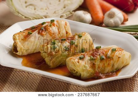 Stuffed Cabbage Rolls With Rice And Meat And Tomato Sauce.