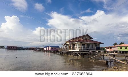 View Of Water Village Known As Patau Patau In Labuan Pearl Of Borneo,,malaysia With Sky Blue Backgro