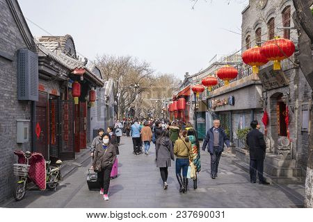 Beijing, China - Mar 20, 2018: People Visiting A Traditional Hutong In Beijing. Hutong Is An Alley I