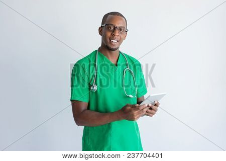 Portrait Of Happy General Practitioner With Digital Tablet. Young African American Medical Student W