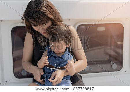 Asian Cute Baby Girl And Beautiful Mother Enjoying On Luxury Yacth Background, Family Lifestyle Conc