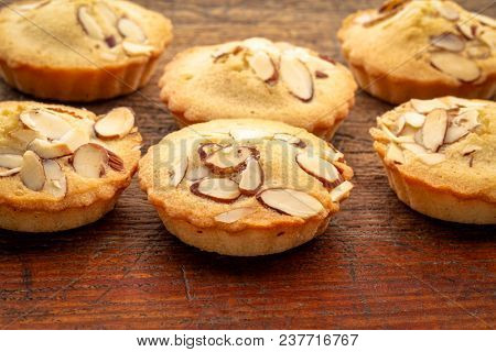 set of French almond cookies against weathered wood background