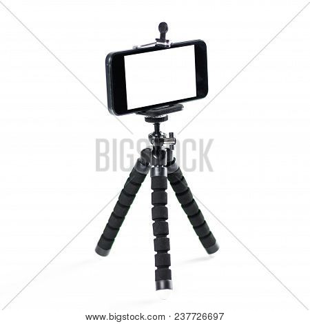 The Phone On The Tripod. Close Up. Isolated On White Background.