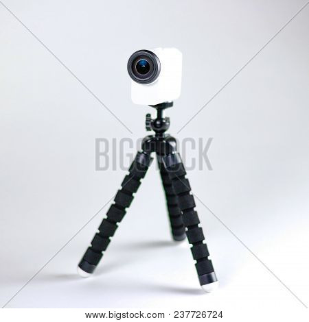 Action Camera On A Small Tripod. Close Up. Isolated On White Background.