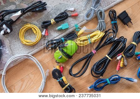 Wires, Cords And Cables Bonded With An Elastic Band On The Floor
