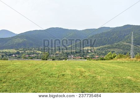 Daylight Picturesque View To Open Green Grass Field