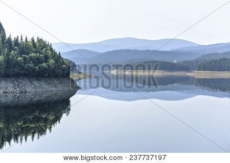 Daylight Misty View To Oasa Dam Lake With Mountains