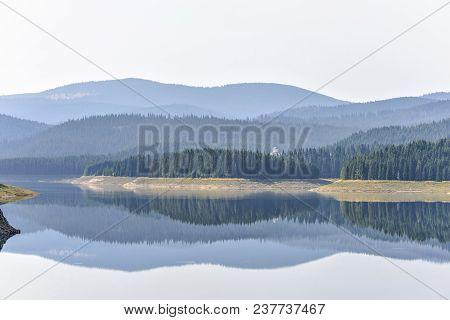 Daylight Misty View To Oasa Dam Lake With Mountains